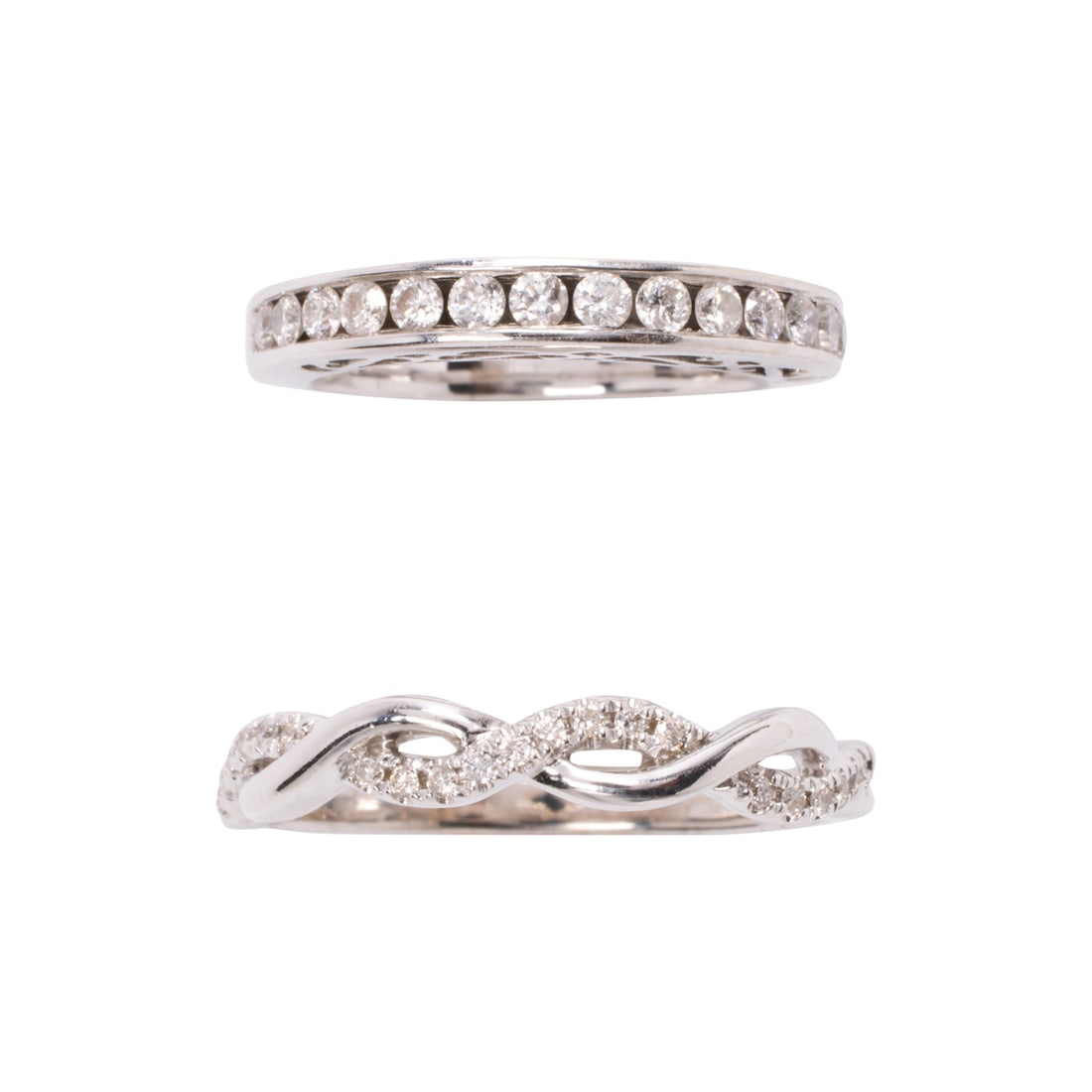 A pair of diamond and 14k white gold rings: A pair of diamond and 14k white gold rings comprising two diamond band each set with round brilliant-cut diamonds; estimated total diamond weight: 0.50 carat; sizes: 4 1/4 and 8 1/2; gross weight: