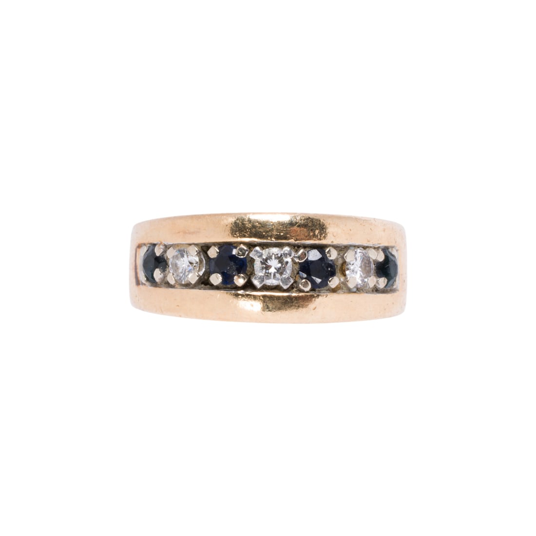 A diamond, sapphire, and 14k gold ring: A diamond, sapphire, and 14k gold ring Designed as a row of four round-cut sapphires and three round brilliant-cut diamonds; size 5; 5.15 grams