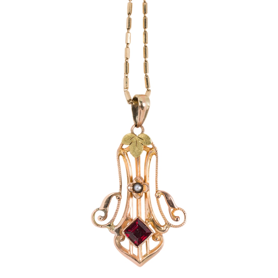 An antique red gemstone, seed pearl and 14k gold pendant necklace: An antique red gemstone, seed pearl and 14k gold pendant necklace Of open-form design, set with one square-cut red gemstone measuring 4.30 x 4.30 mm, accented by one seed pearl, on modern fancy link c