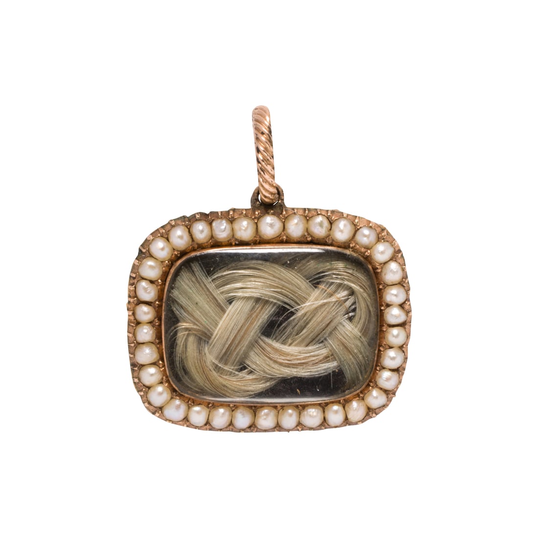A Victorian seed pearl and 14k gold mourning pendant: A Victorian seed pearl and 14k gold mourning pendant Featuring a woven lock of hair framed by seed pearls, the verso accented by an intricately engraved lattice pattern and flowers; length: 1 in; 4.75