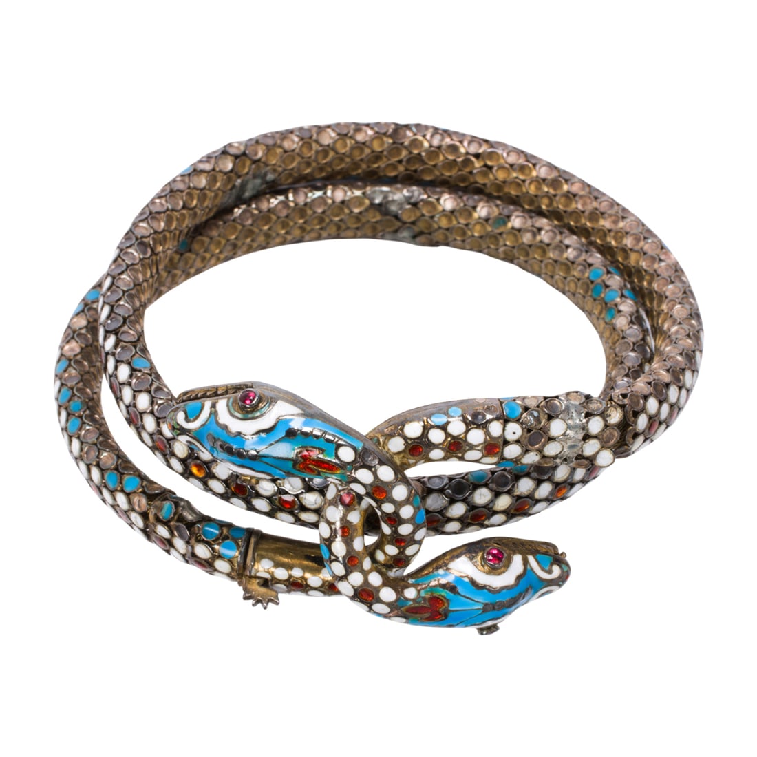 An antique enamel, ruby, and silver snake cuff bracelet: An antique enamel, ruby, and silver snake cuff bracelet Designed as interwoven snakes, with scale detailing accented by orange, blue, and white enameling and round-cut ruby eyes; interior circumferenc
