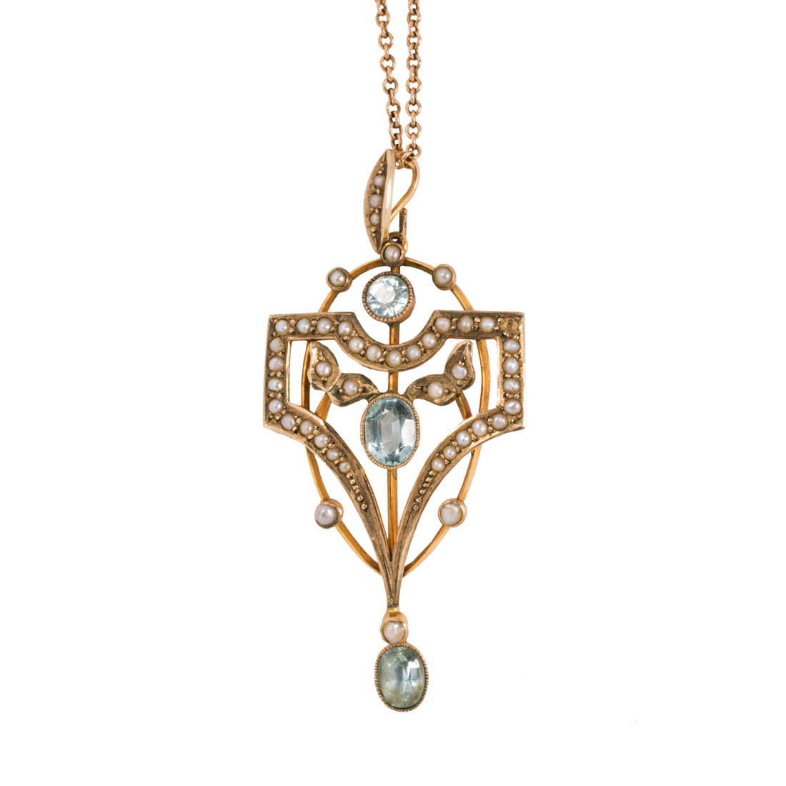 An Art Nouveau aquamarine, seed pearl, 9k and 10k gold pendant necklace: An Art Nouveau aquamarine, seed pearl, 9k and 10k gold pendant necklace Of open-form lavalier style, intricately set with seed pearls, one round-cut and two oval-cut aquamarines weighing a total of ap