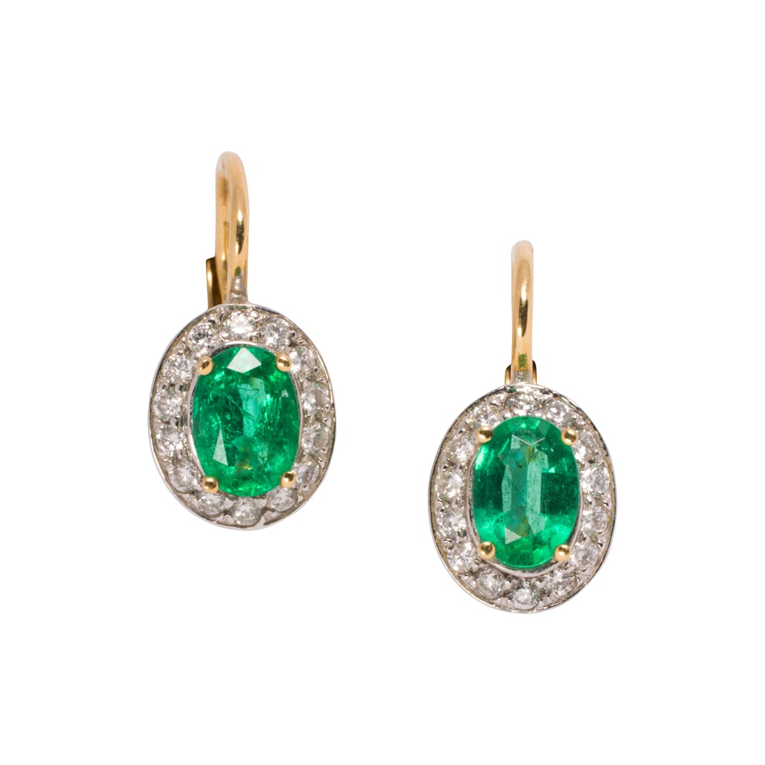 A pair of emerald, diamond, and 18k bi-color gold earrings: A pair of emerald, diamond, and 18k bi-color gold earrings Centering oval-cut emeralds weighing approximately 0.55 carat each, framed within a halo of round brilliant-cut diamonds; length: 3/4 in; 4.8