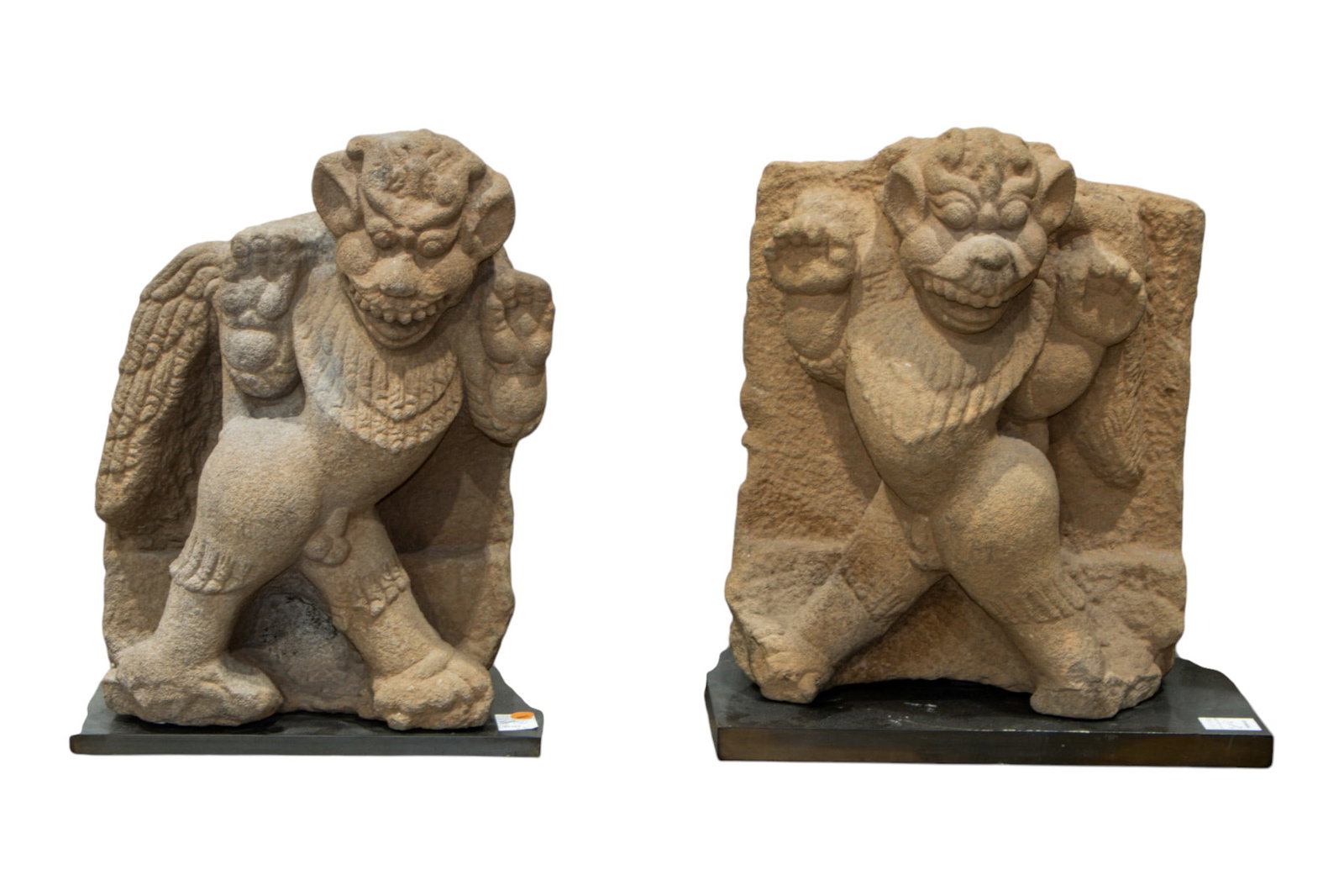 A pair of Kingdom of Champa sandstone heraldic lions: A pair of Kingdom of Champa sandstone heraldic lions. Late Tra Kieu period (10th century), with acrylic stands, 19.25"h x 15"w excluding the stand. Provenance: purchased from Sculpture Gallery, Hong K