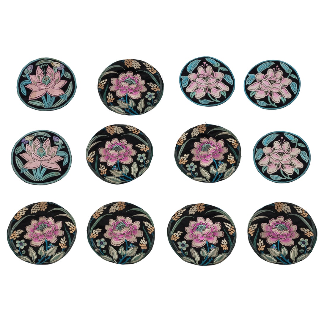 (lot of 12) Chinese embroidered silk 'lotus' roundels: (lot of 12) Chinese embroidered silk 'lotus' roundels. Early 20th century, from 5.125" to 5.375" across.