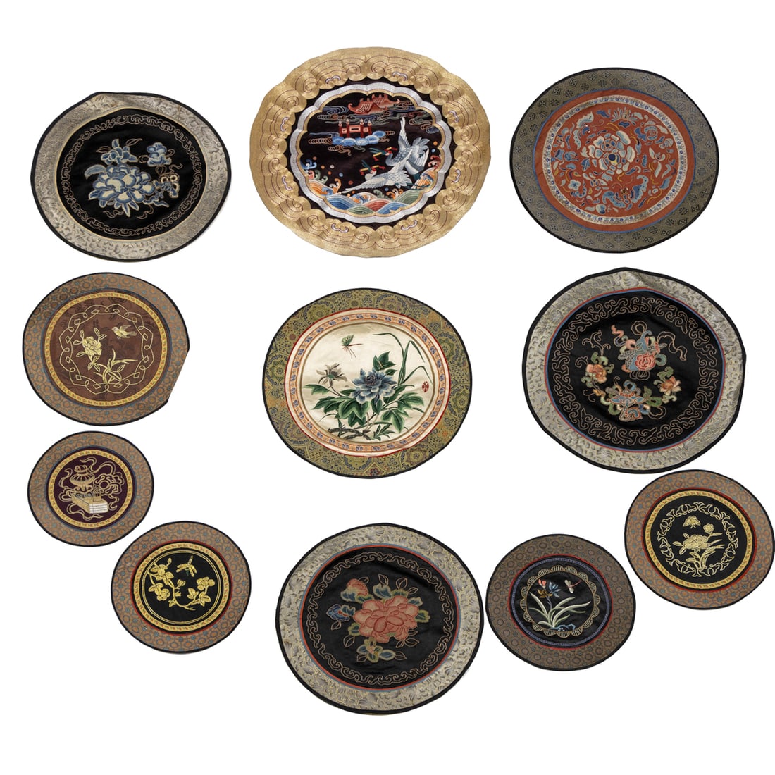 (lot of 11) Chinese embroidered silk roundels: (lot of 11) Chinese embroidered silk roundels. Featuring bird motif, and some of forbidden stitched flower, 20th century, from 8.375" to 17" across.