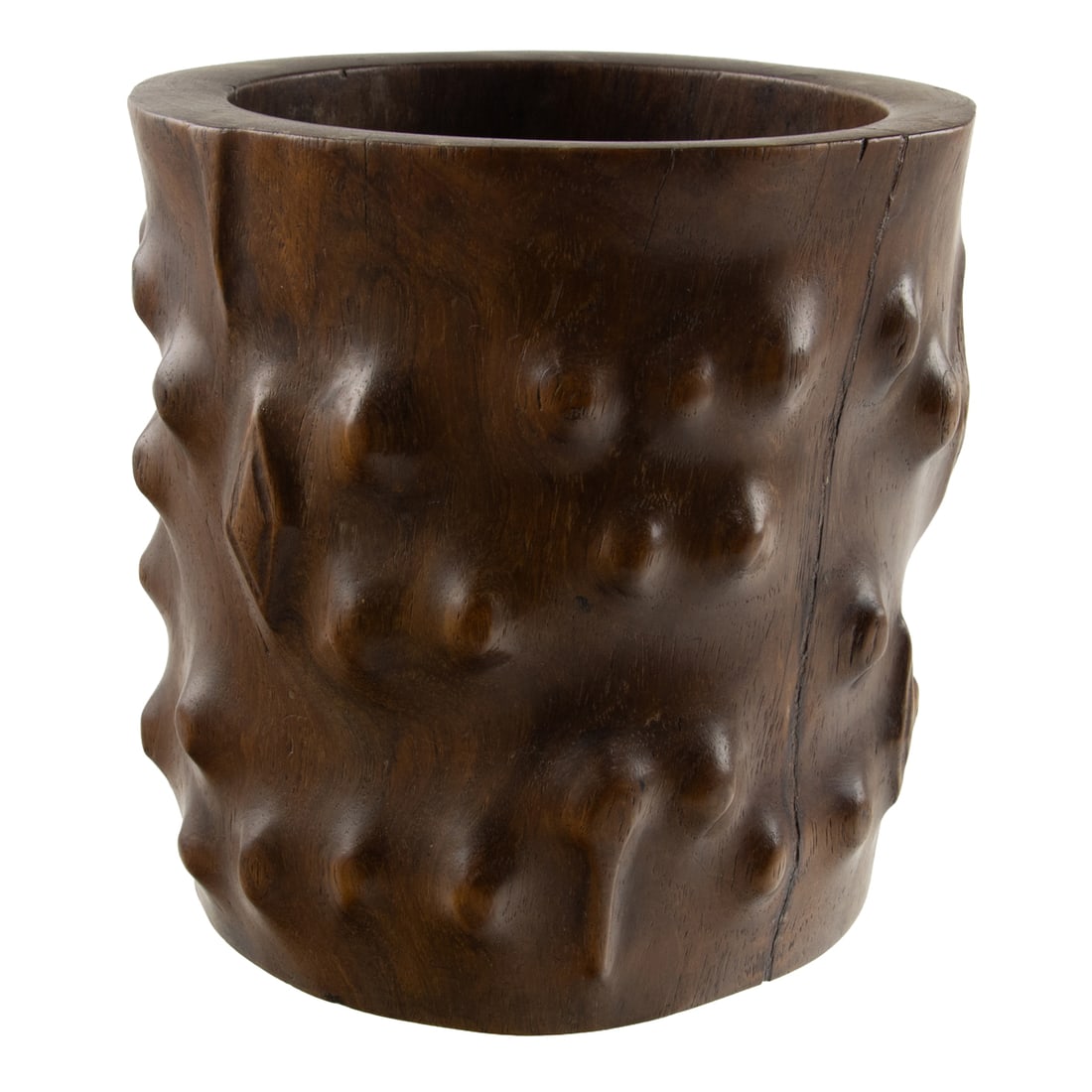 A Chinese huanghuali 'faux burl' brush pot: A Chinese huanghuali 'faux burl' brush pot. Carved with thick sides in imitation of burl wood, showing gnarls and knobs, with a carved base plug, 18th century, 6.375" diameter. Condition: repaired cra