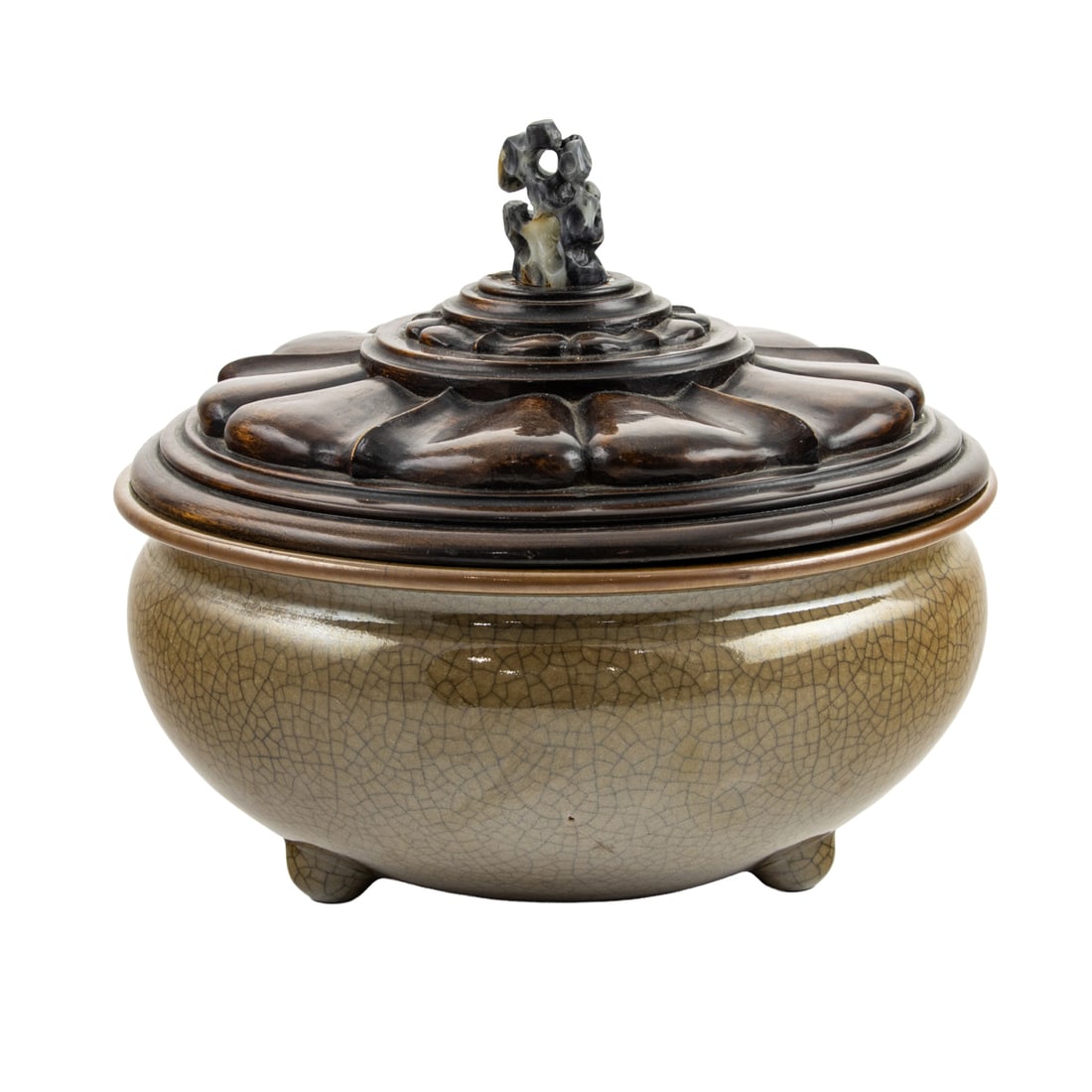 A Chinese crackle glazed tripod censer: A Chinese crackle glazed tripod censer. The wooden lid with a black and white jade finial, 18th century, 10.625" across.