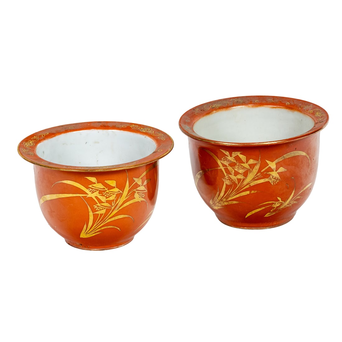 A pair of Chinese gilt decorated coral ground orchid pots: A pair of Chinese gilt decorated coral ground orchid pots. Republic period, 6.5" across.