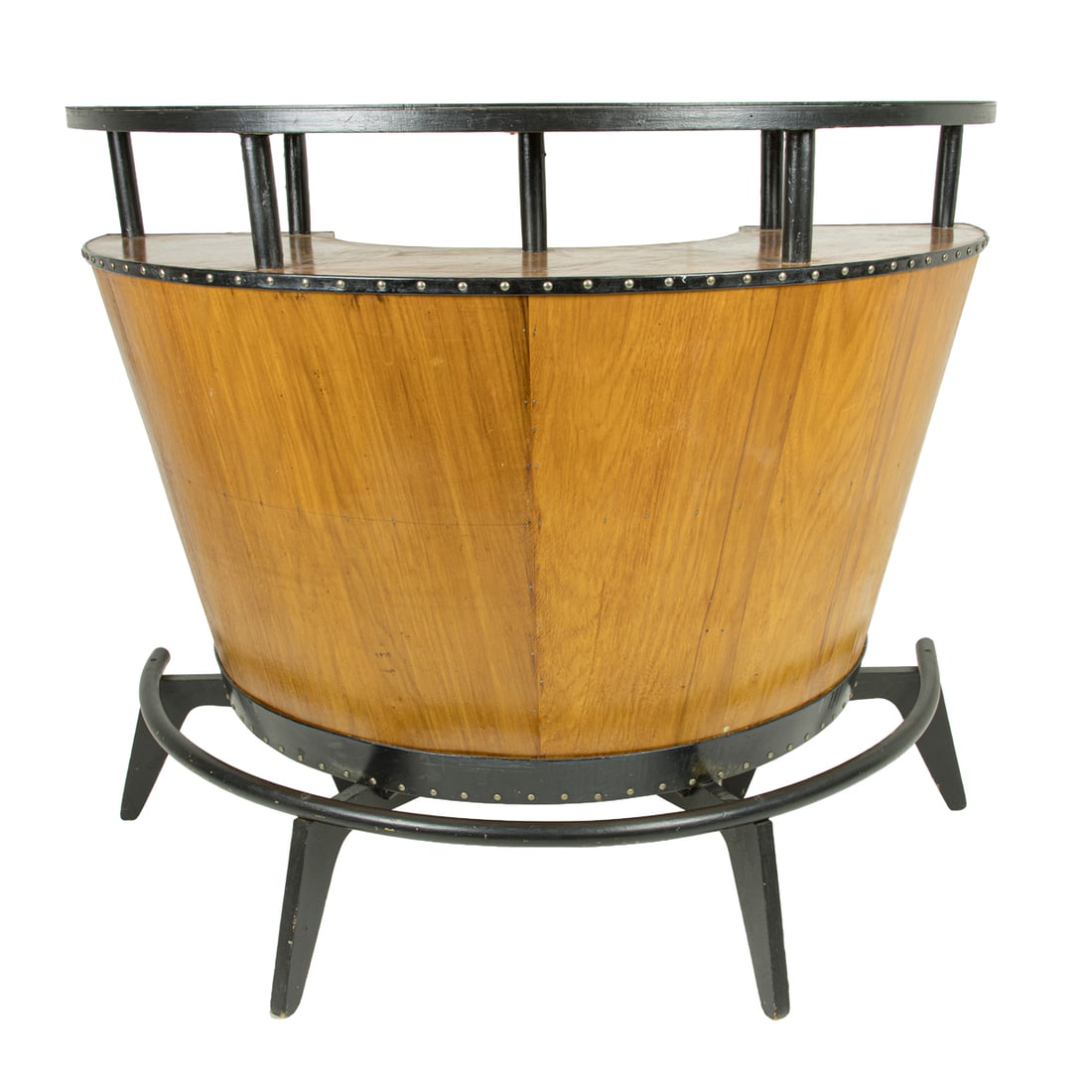 A Brazilian José Zanine Caldas attributed curved plywood dry bar: A Brazilian José Zanine Caldas attributed curved plywood dry bar, with a black laminate top above the highly figured wood veneer front with black piping and brass nail head trim, with the interior ha