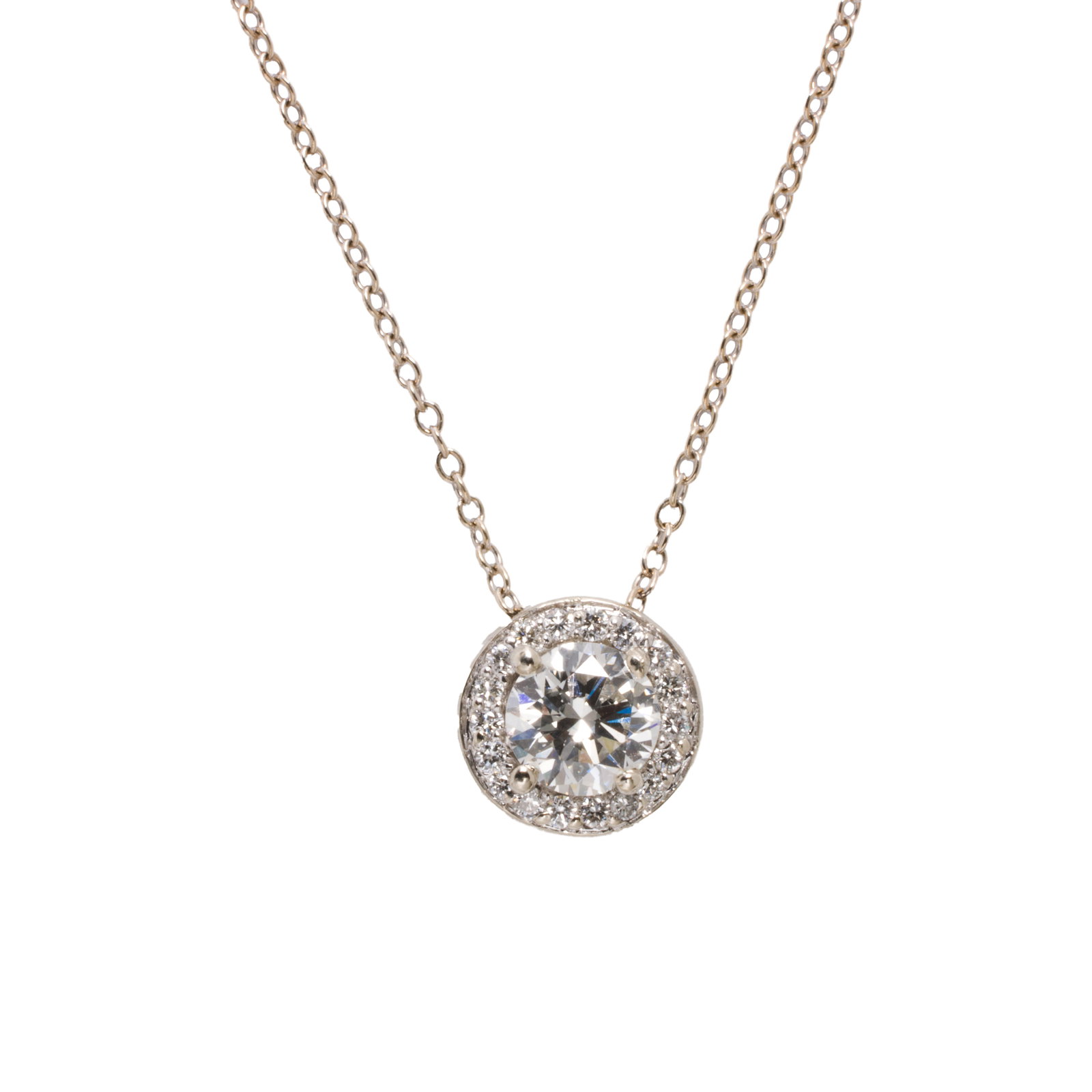 A diamond and 14k gold pendant necklace: A diamond and 14k gold pendant necklace centering a round brilliant-cut diamond weighing approximately 0.63 carat, framed by additional diamonds; estimated total diamond weight: 0.80 carat; chain leng