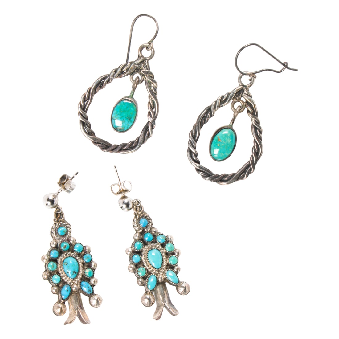A pair of turquoise and sterling silver earrings: A pair of turquoise and sterling silver earrings Of open form design, set with oval-shaped turquoise cabochons measuring 9.92 x 6.71 mm; length: 1 5/8 in; 7.20 grams