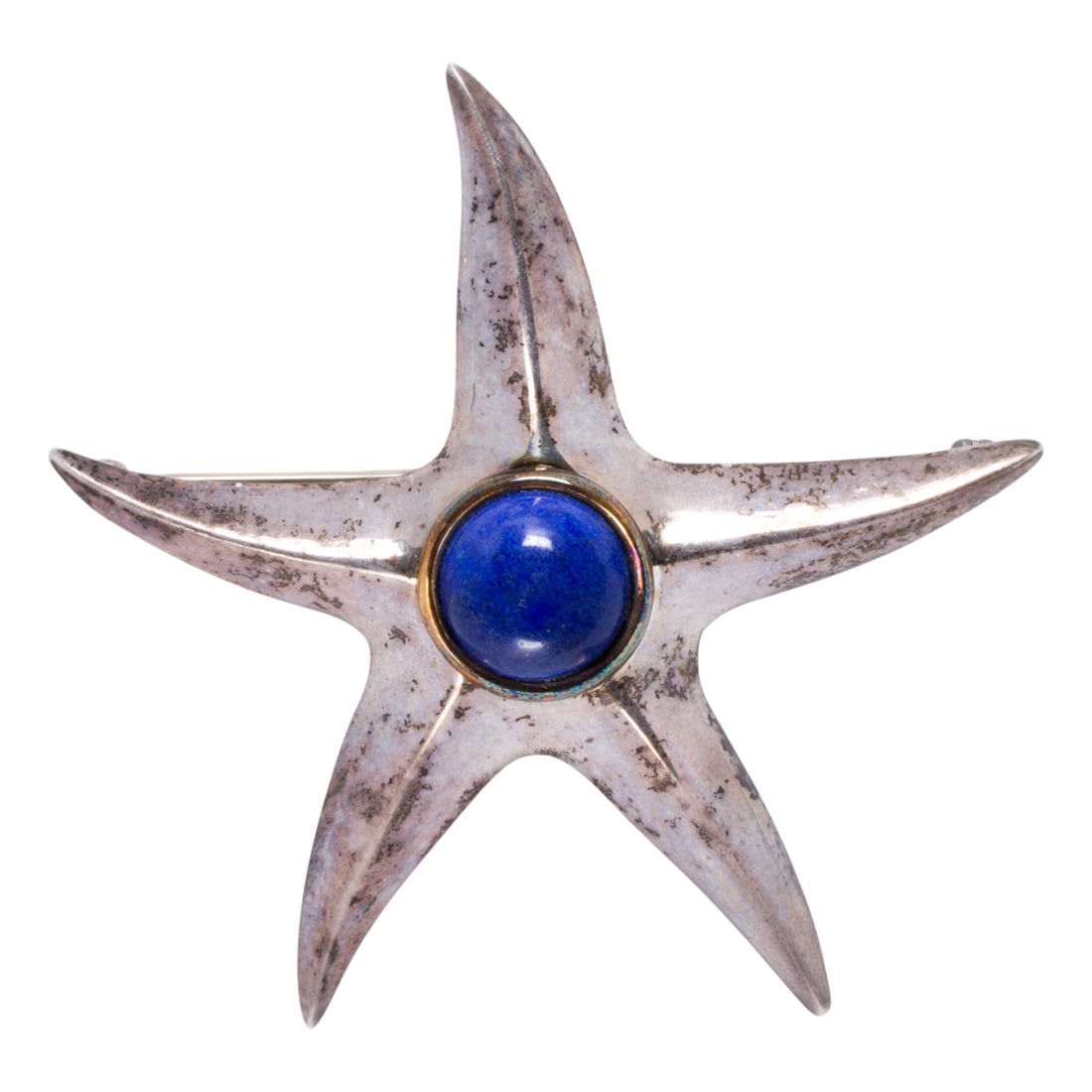 A silver starfish brooch: A silver starfish brooch Centering a round lapis lazuli cabochon measuring approximately 9.85 mm in diameter; length: 2 in; 10.90 grams