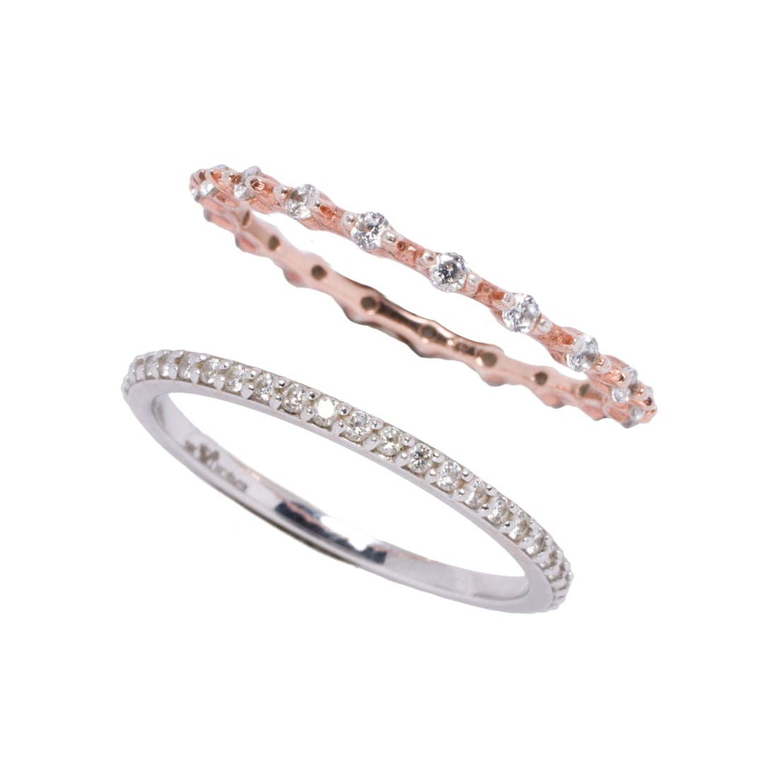 Two diamond and 14k gold bands: Two diamond and 14k gold bands Comprising one white gold and one rose gold band set with round brilliant-cut diamonds; estimated total diamond weight: 0.80 carat; sizes 9 1/4; gross weight: 3.15 grams