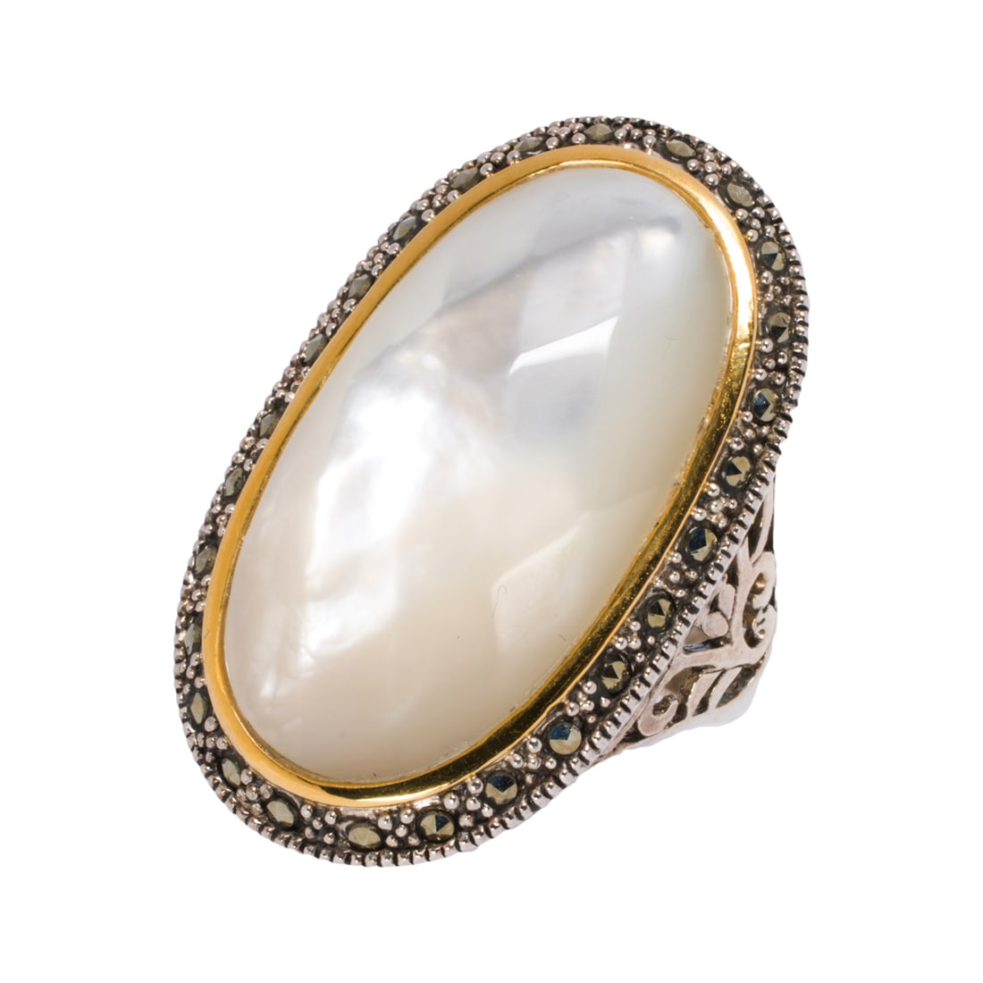 A mother of pearl, silver and 14k gold ring: A mother of pearl, silver and 14k gold ring Centering a faceted mother-of-pearl cabochon measuring 28.23 x 15.88 mm, set within open-form sterling silver mounting and accented by 14k gold; size 9; 11.