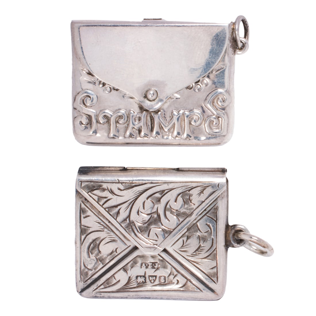 Two antique sterling silver stamp envelope pendants: Two antique sterling silver stamp envelope pendants Comprising one designed with etched scrollwork and one embossed with flowers and the word "Stamps"; widths: 1 and 1 1/8 in, respectively; gross weig