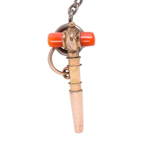A coral and gold-filled watch key and chain