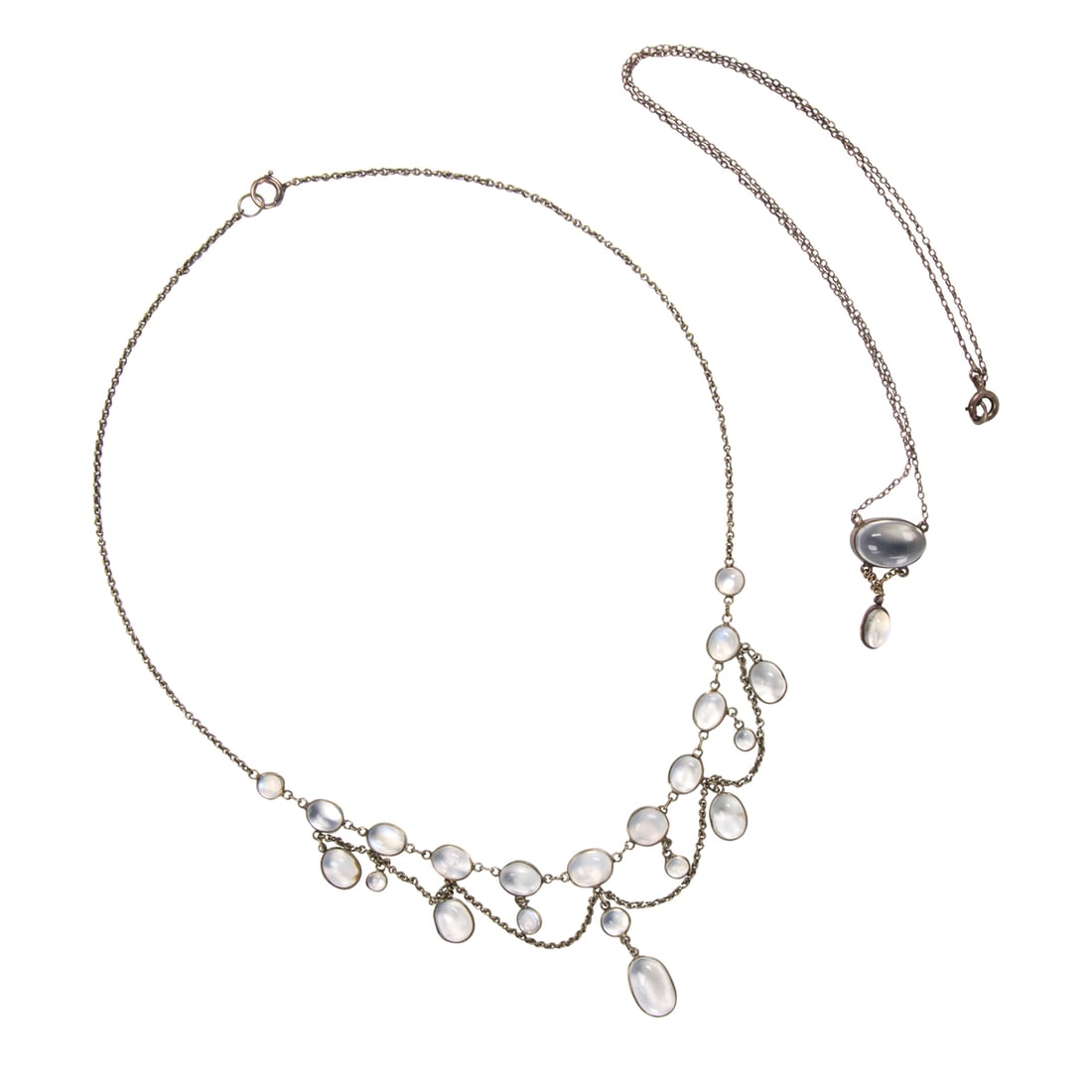 A group of moonstone and silver jewelry: A group of moonstone and silver jewelry comprising an Edwardian style necklace, a pendant necklace, and a pendant; necklace lengths: 16 and 18 in, respectively; pendant length: 1 in; 7.00 gross grams