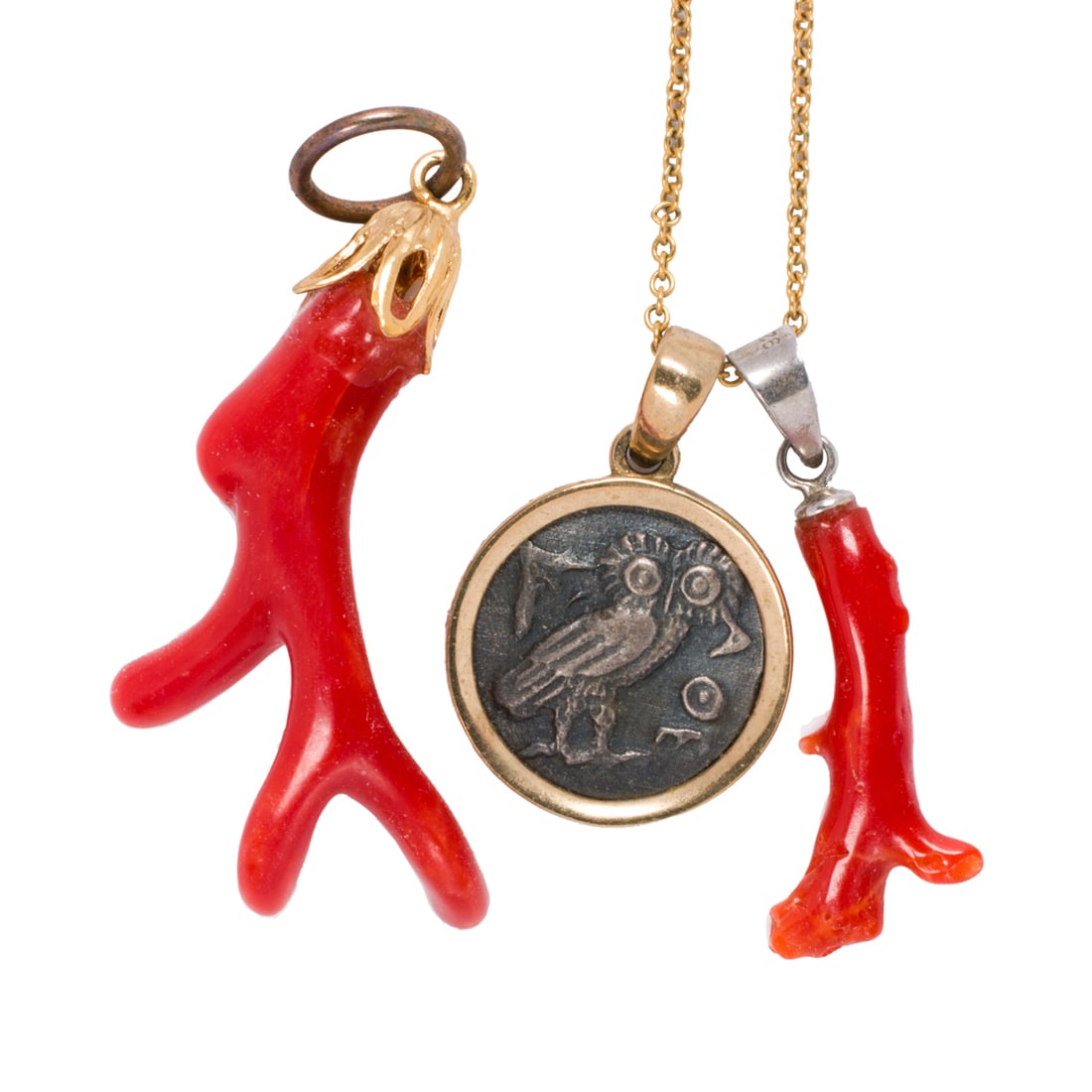 A coral, 14k gold, and gold-filled pendant and pendant necklace: A coral, 14k gold, and gold-filled pendant and pendant necklace Comprising one polished coral branch pendant on gold-filled bail, together with a necklace comprising a reproduction Greek coin set