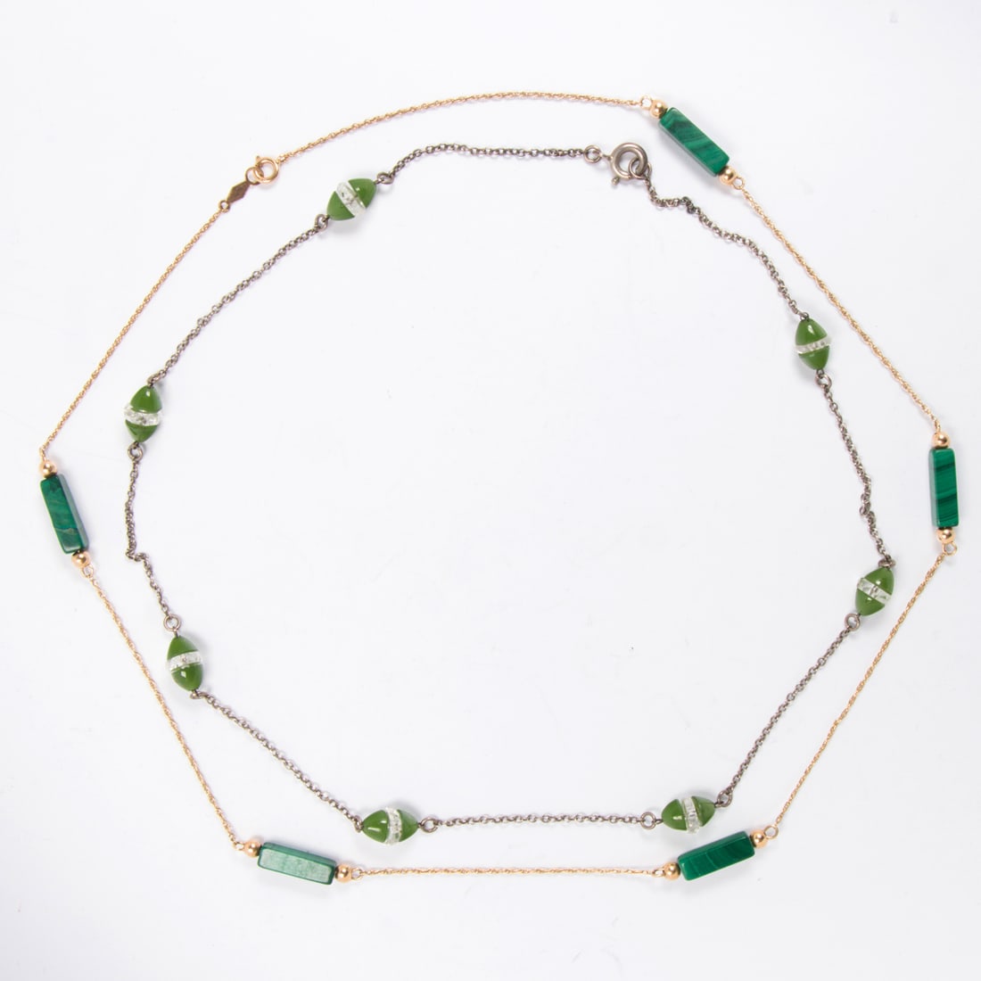 Two green hardstone necklaces: Two green hardstone necklaces Comprising one necklace designed with hardstone eggs, together with one featuring rectangular malachite beads on 14k gold chain; lengths: 16 and 17 in, respectively;