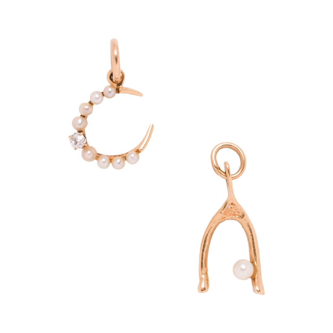 Two pearl, diamond and 14k gold pendants: Two pearl, diamond and 14k gold pendants Comprising one designed as a wish bone and one of crescent design set with a round brilliant-cut diamond; lengths: 1/3 and 1/2 in, respectively; 1.40 gross gra