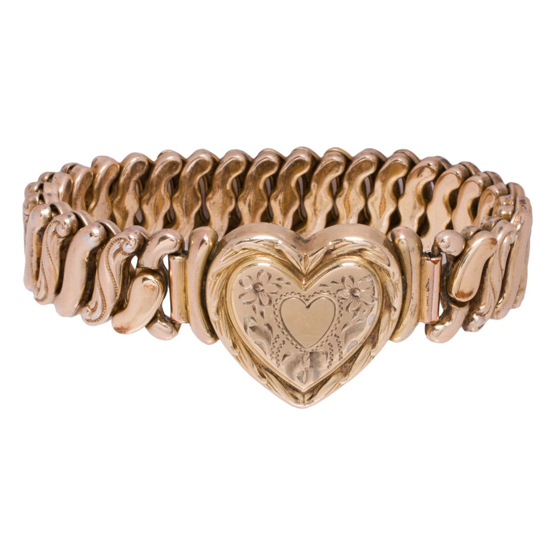 A gold-filled sweetheart bracelet: A gold-filled sweetheart bracelet Designed as a engraved heart medallion on expandable bracelet; bracelet interior circumference: 4-7 1/2 in; 25.00 grams