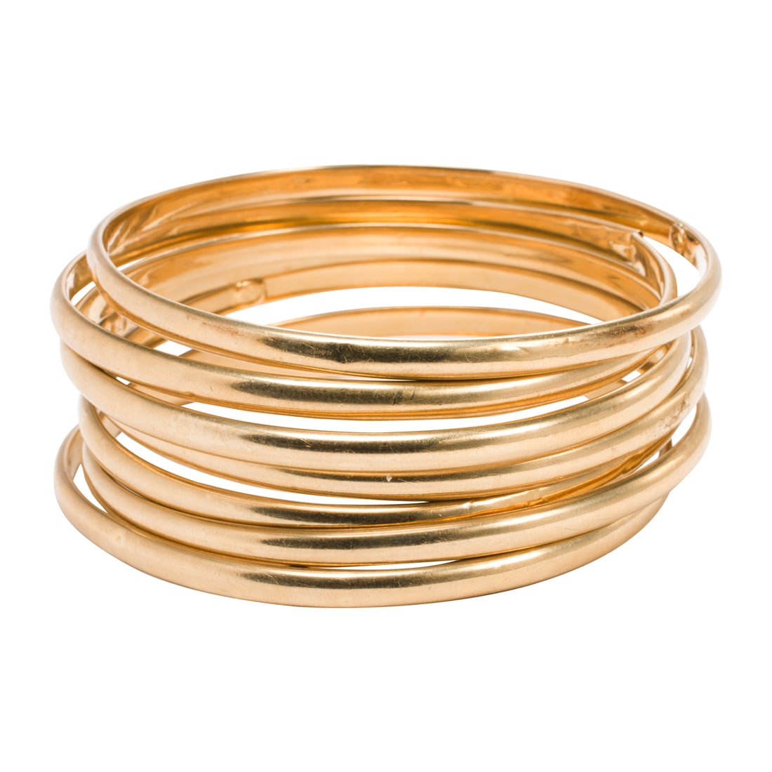 Seven 14k gold bangles: Seven 14k gold bangles Of hollow-form design; interior diameter: 2 3/8 in; gross weight: 29.30 grams Condition note: one of seven bangles is broken