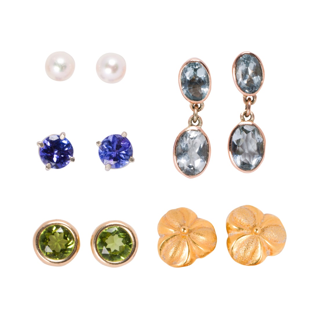 Five pairs of gold stud earrings: Five pairs of gold stud earrings Comprising five pairs of gold stud earrings of varying materials including 14k white gold; gross weight: 6.30 grams
