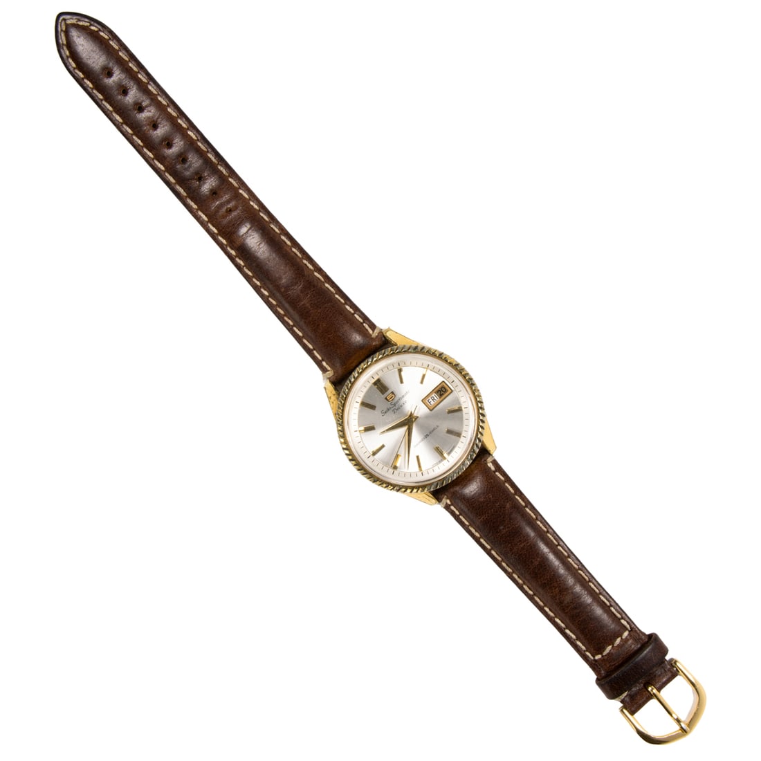 A Seiko Sportsmatic Deluxe stainless steel Watch: A Seiko Sportsmatic Deluxe stainless steel Watch Case no.: 6401612The champagne-toned face, gold stick indices, gold dauphine hands, date indicator, containing a diashock 25 jewels movement, within po