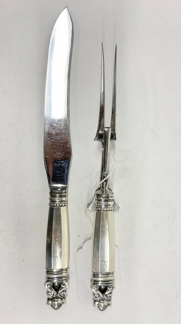 A George Jensen Acorn pattern sterling carving set: A George Jensen Acorn pattern sterling carving set, each monogrammed with an 'L' in script, the greatest 12.5 "l [2 total]