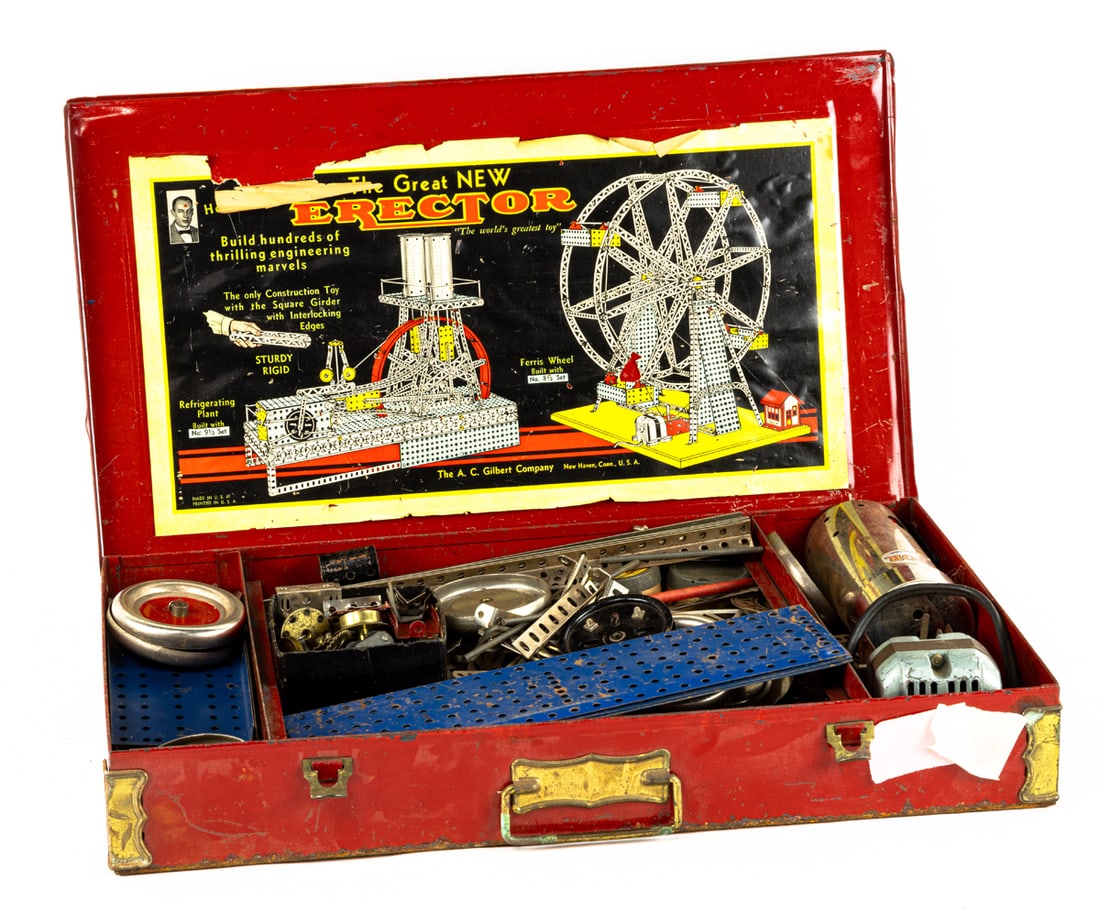 An A.C. Gilbert erector set in red metal box: An A.C. Gilbert erector set in red metal box, mid 20th century, box 3"h x 20"w x 12"d