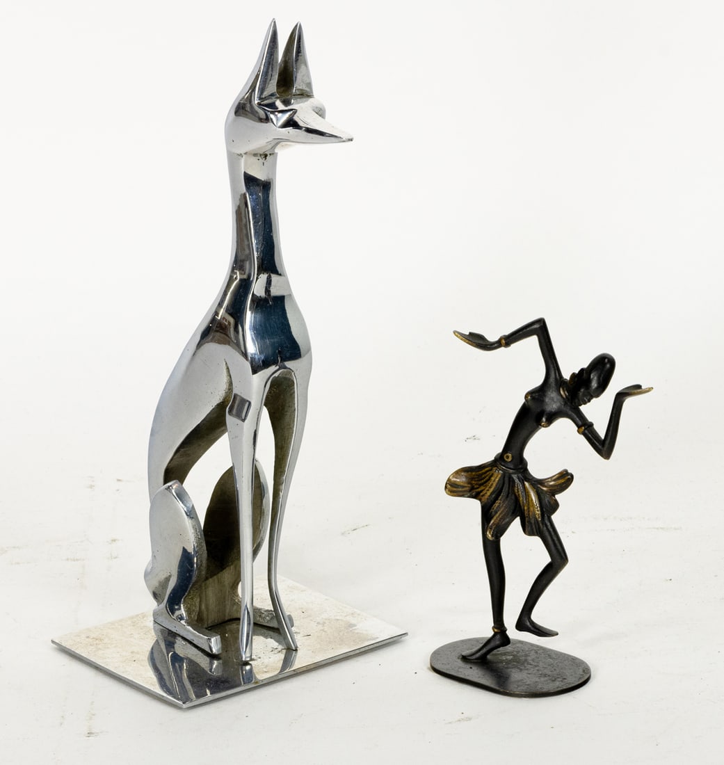 A Richard Rohac patinated bronze figure of an African dancer and Hagenauer style nickeled bronze: A Richard Rohac patinated bronze figure of an African dancer and Hagenauer style nickeled bronze figure of a seated hound, 5"h (dancer), 9"h (hound) [2 total]