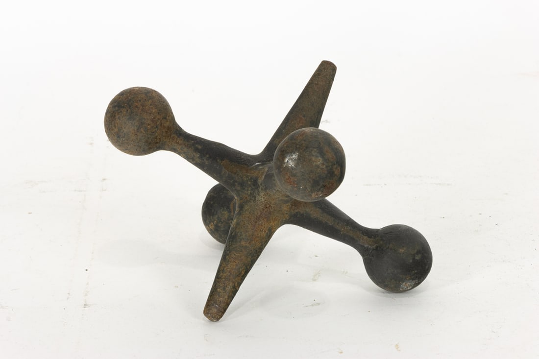 A cast iron model of a jack: A cast iron model of a jack, 5"h x 6.5"sq