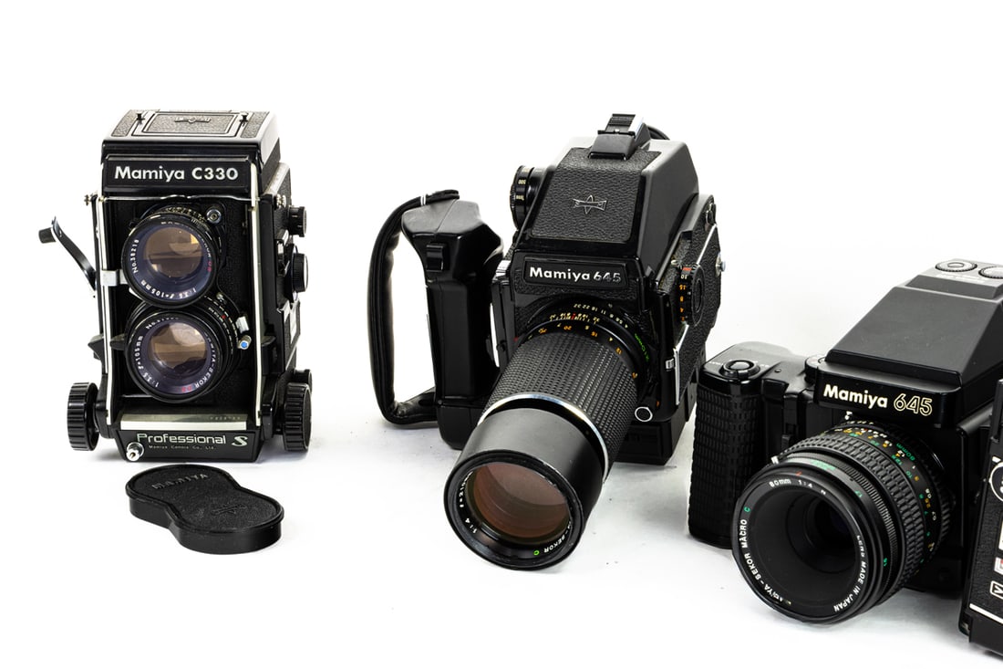 Three Mamiya medium format cameras and accessory - 2