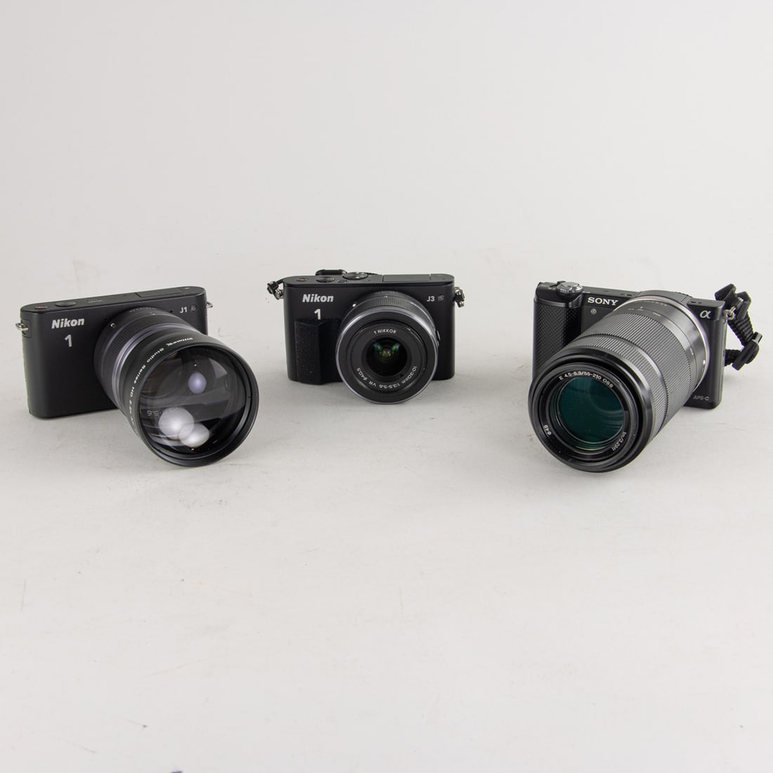 An assembled group of mostly Nikon digital cameras (1 of 2)