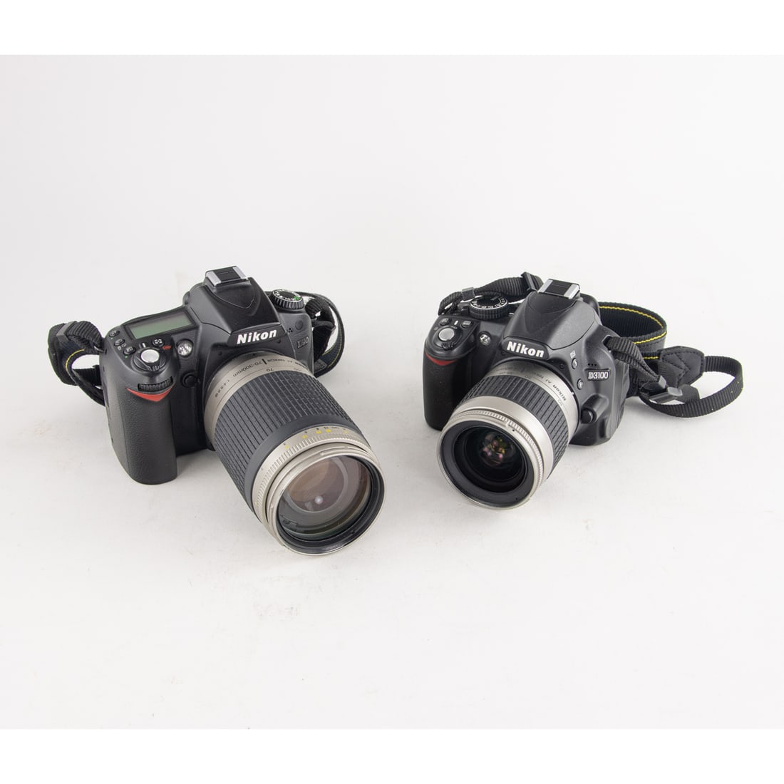A group of two Nikon dslr cameras: A group of two Nikon dslr cameras, one soft case, two nikon battery chargers [5 total]