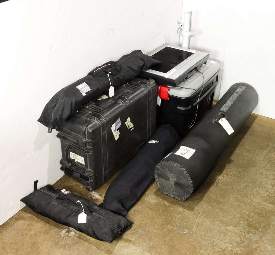 A group of photo equipment and monitor: A group of photo equipment and monitor, (4) soft box covers, (3) umbrellas, (1) bin of assorted lighting fixtures, (1) monitor with mount, (1) case of stands, (3) Bowen studio lights with case and