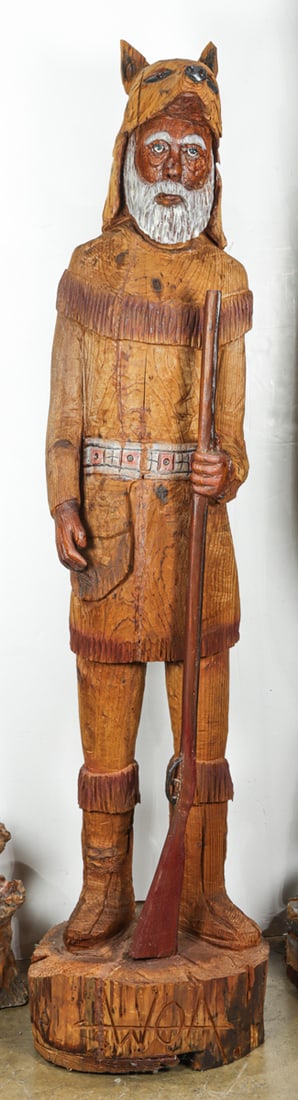 A carved and polychrome tobacco shop frontier figure: A carved and polychrome tobacco shop frontier figure, incised 'WOA', 77"h x 19"dia (base)