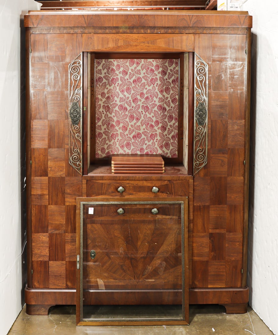 A French Art Deco cabinet vitrine circa 1940: A French Art Deco cabinet vitrine circa 1940, the lined central cabinet flanked by the wrought metal mounts fronting the two doors opening to fixed shelves, the entire case with highly figured