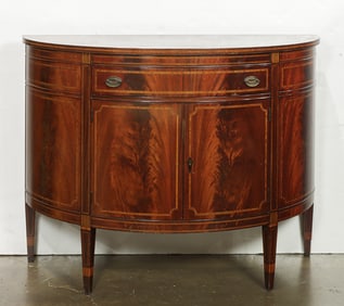 A Regency style demilune cabinet