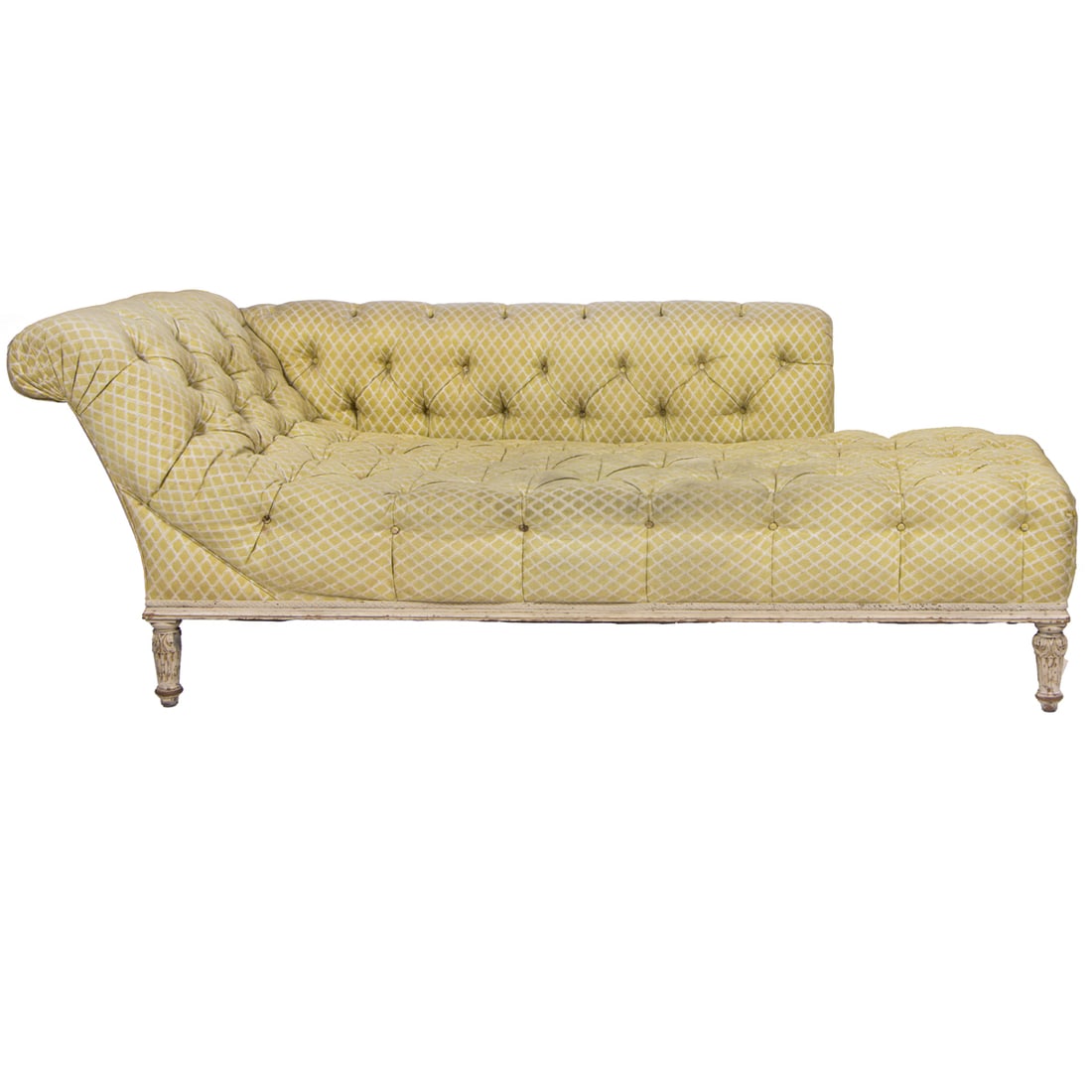 A Neoclassical style chaise lounge: A Neoclassical style chaise lounge, the tufted yellow upholstered seat raised on painted and leaf carved feet, 31"h x 74"w x 30"d (seat). Provenance: From the Estate of Margaret G. Huntington; by