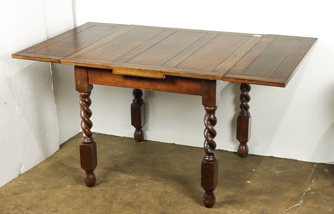 A Spanish Baroque style oak extendable dining table (1 of 1)