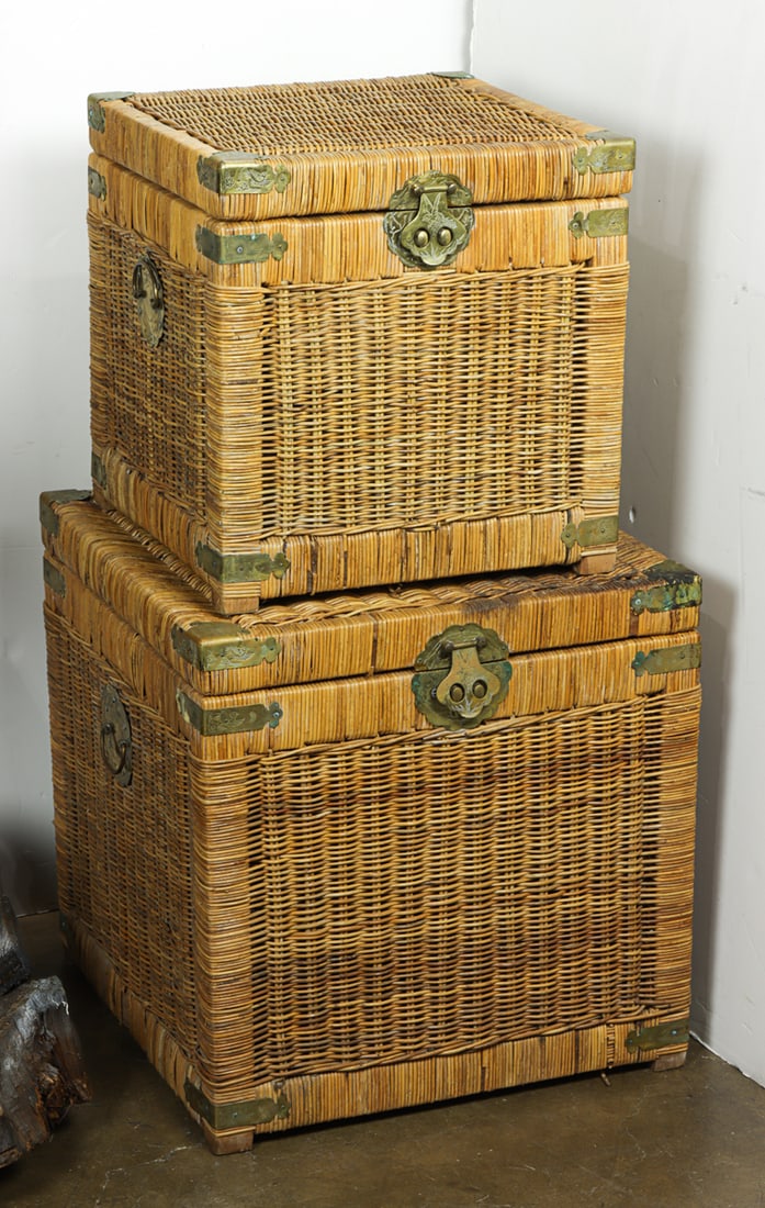 A graduated pair of wicker basket trunks: A graduated pair of wicker basket trunks, largest 20.5"h x 20"sq, smaller 16.5"h x 16"sq