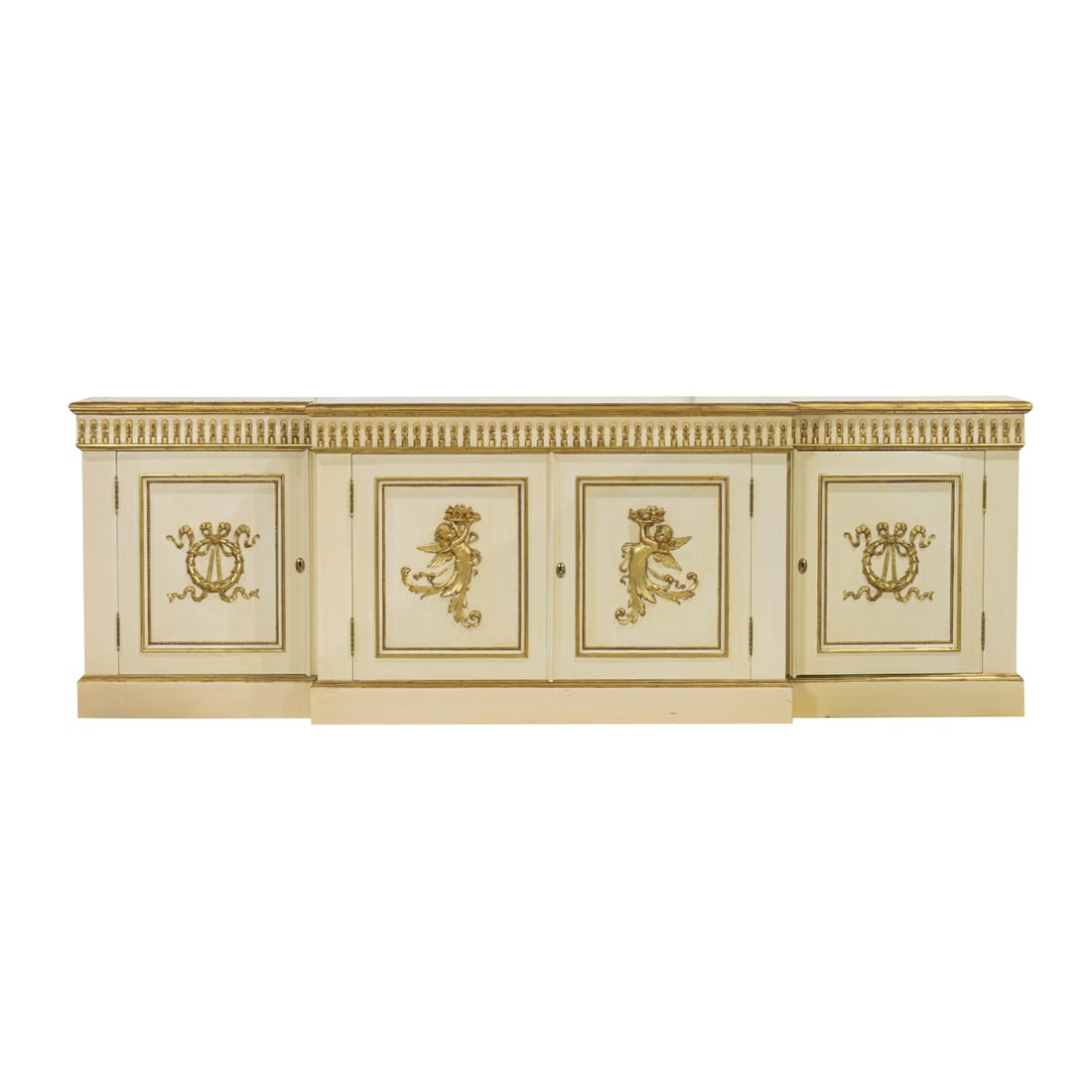 A large Hollywood Regency style parcel gilt cream painted sideboard: A large Hollywood Regency style parcel gilt cream painted sideboard, the outset top above fluted band, over conforming case with four doors decorated with infant terms and ribbon tied wreaths, 35"h x