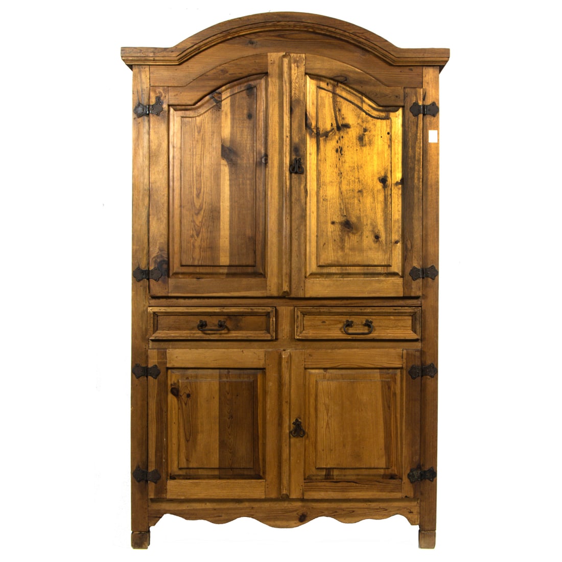 A Country pine armoire: A Country pine armoire, late 20th century, the arched top fitted with two doors, over two drawers and two doors, fitted with iron strap hinges and hardware, 78.5"h x 47.5"w x 24.5"d