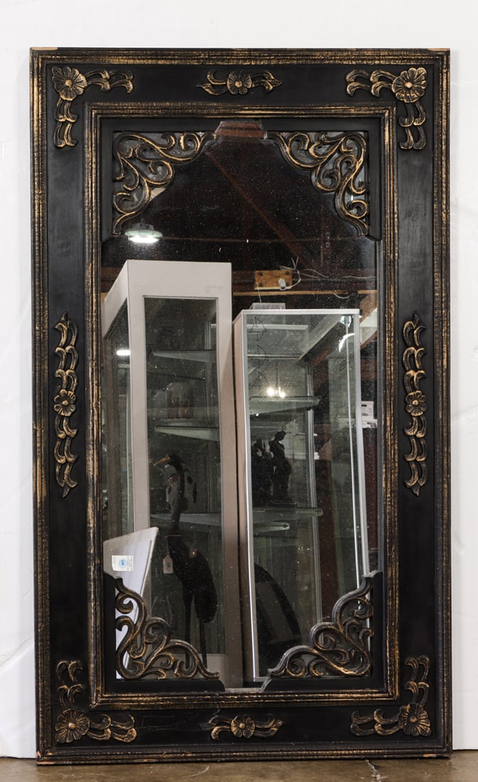 A Spanish Revival style carved wall mirror: A Spanish Revival style carved wall mirror, 58.5"h x 34.5"w