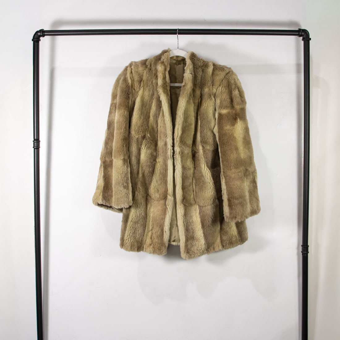 A faux fur: A faux fur, 30"l x 17"w (shoulders)