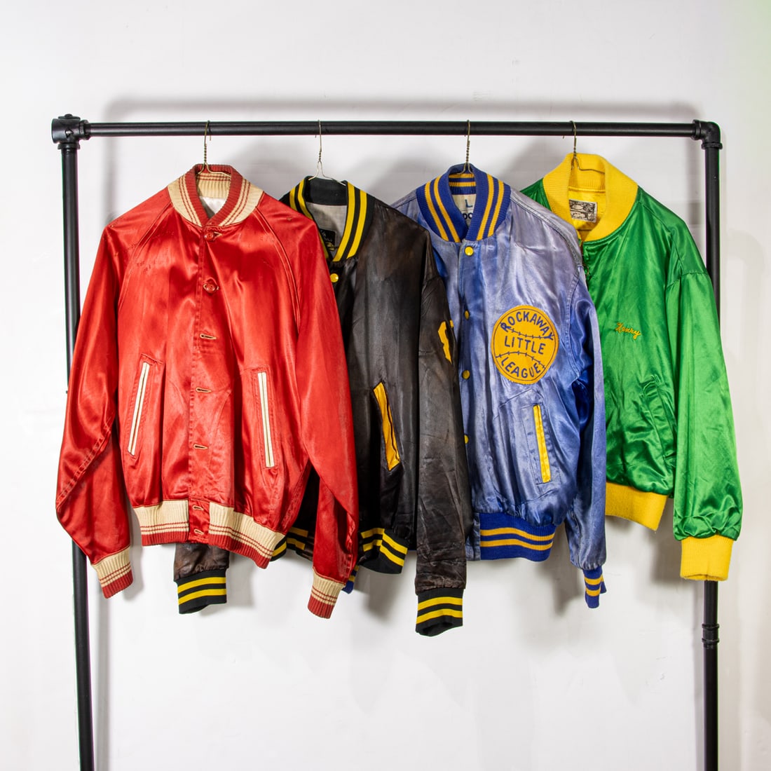 Four vintage satin jackets: Four vintage satin jackets, (1) red "Plainsville" size not labeled , (1) black "Williamsbridge Royal" size medium, (1) navy "Rockaway Little League" size large, (1) kelly green "Gribbitt" size not