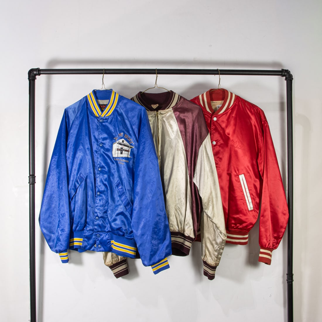 Three vintage satin jackets: Three vintage satin jackets, (1) burgundy and silver size 46, (1) red size medium, (1) blue size large