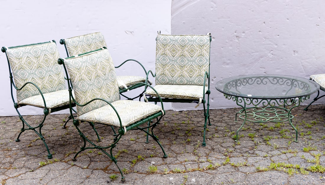 A patio set: A patio set, (4) green painted iron armchairs 36"h x 20"w x 22"d, (1) circular coffee table 18"h x 36"w [5 total]